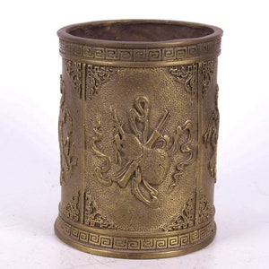 Folk collection of hand-carved brass pen holders