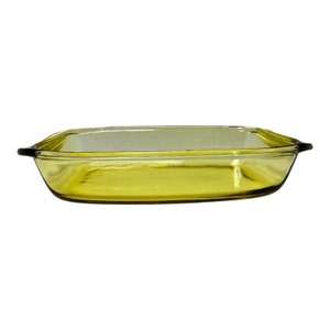 May include: A yellow glass baking dish with a rectangular shape.