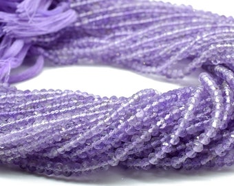 May include: A strand of light purple amethyst beads. The beads are faceted and have a slightly irregular shape. The strand is approximately 16 inches long.