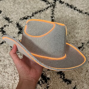 sliver glitter cowboy hat with orange lights