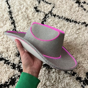 silver glitter cowboy hat with pink lights