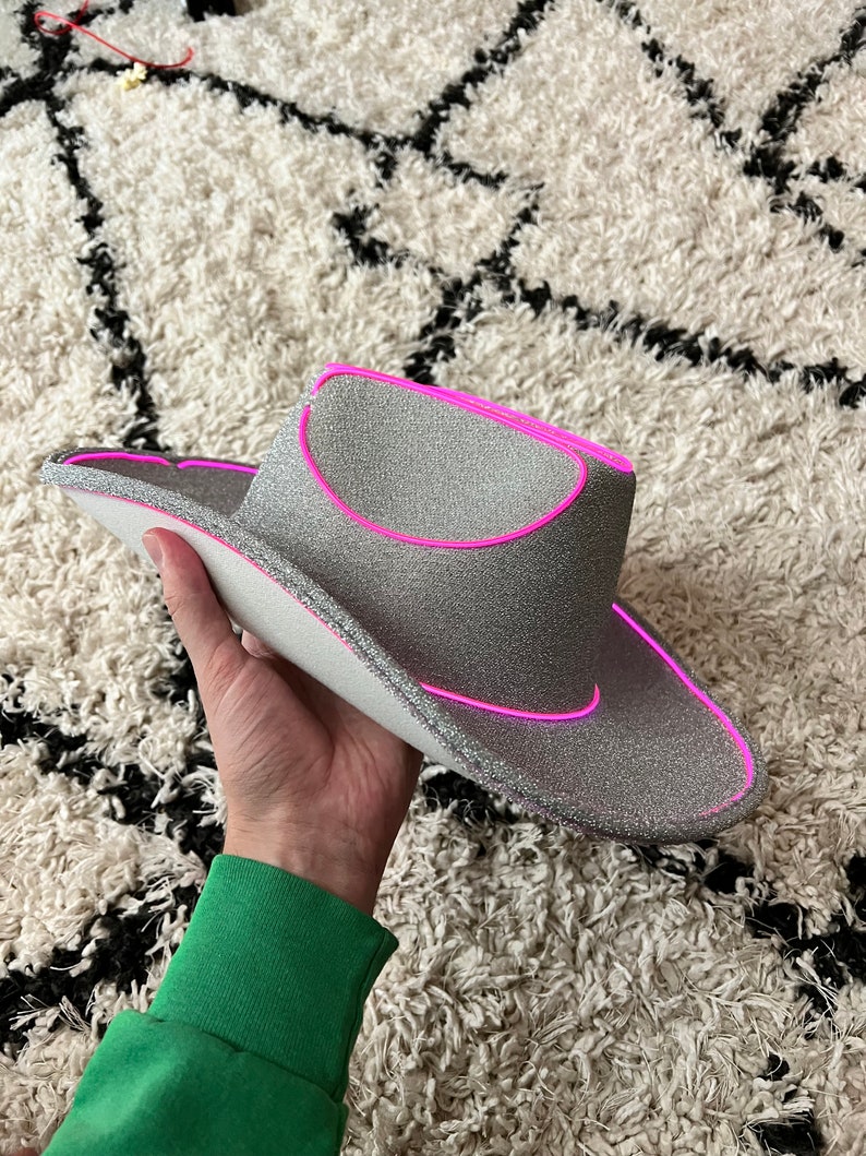 silver glitter cowboy hat with pink lights