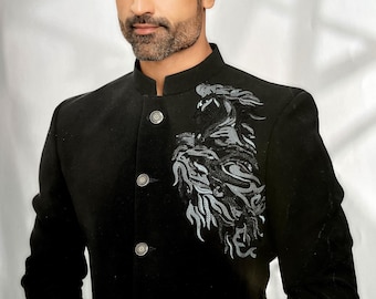 May include: Black velvet jacket with a mandarin collar and silver buttons. The jacket features an embroidered design on the chest. The formal wear jacket is a stylish garment for special occasions.