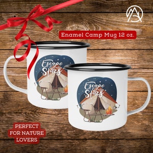 May include: Two white enamel camping mugs with black rims. Both mugs feature a blue night sky with stars, a campfire, a tent, and two camping chairs. The text "Escape the Stars" is printed on each mug.