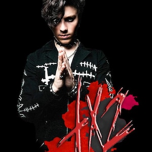 May include: A person wearing a black jacket with white stitching and a choker necklace. The image features a red graphic with the letters "HV". The background is black.