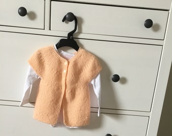Small wool bra with short sleeves light orange knitted in 3 months for baby