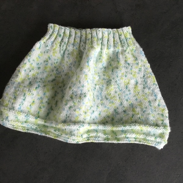 Hand-knitted skirt for baby from 12 to 18 months white mottled green and blue