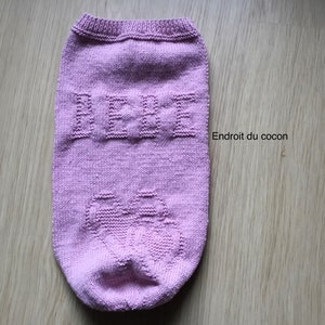 Knitted pink birth cocoon for babies from birth to 3 months