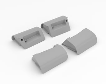 May include: Four gray plastic door handles, two with a recessed grip and two with a curved shape.