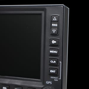 May include: Close-up of a black electronic device with a screen and buttons. The buttons are labeled with text such as "RNG", "MENU", "CLR", and "ENT". The device has a GPS function.