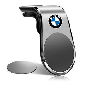 Puede incluir: Soporte para teléfono de coche plateado y negro con el logotipo de BMW. El soporte tiene una superficie magnética y una pinza para fijarlo a una rejilla de ventilación. Se incluye una placa metálica redonda separada.
