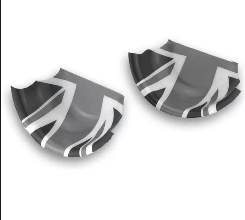 May include: Two grey and black car door handle covers with a Union Jack design.
