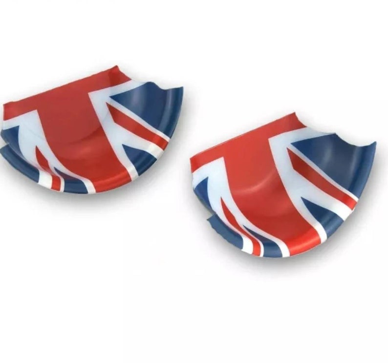 May include: Two red, white and blue Union Jack car door handle covers. The covers are shaped like a half-circle and have a 3D effect.
