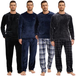 May include: Four sets of plush pyjamas in various colours. The sets include a long-sleeved crew neck top and matching trousers. Colours include black, navy, and grey. One set features plaid trousers. Each top has a small emblem.