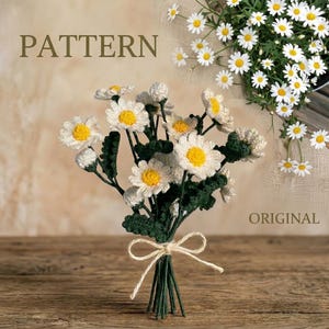 May include: A handmade bouquet of crocheted daisies with white petals and yellow centres, tied with a cream-coloured twine bow. The bouquet features green stems and leaves, with the word "PATTERN" visible in the image.