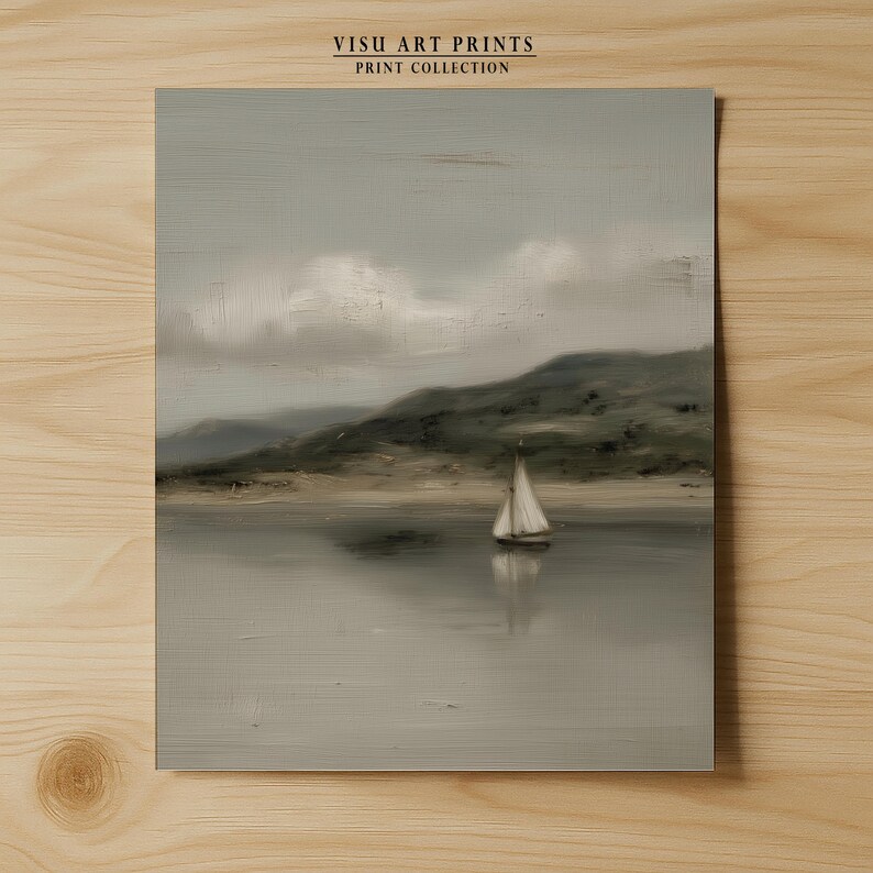 May include: A serene landscape painting featuring a sailboat on calm water, with a backdrop of rolling hills and a cloudy sky. The artwork is in muted tones of gray, beige, and green, evoking a sense of tranquility. The text "VISU ART PRINTS PRINT COLLECTION" is at the top.