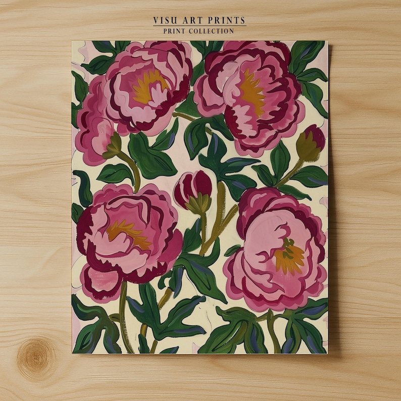 May include: A floral print featuring large pink peonies with yellow centers and green leaves against a cream background. The artwork is titled "VISU ART PRINTS PRINT COLLECTION". The painting is displayed on a wooden surface.