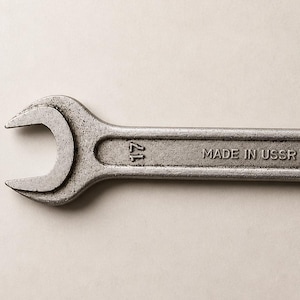 May include: A silver-coloured spanner with open ends, marked with the numbers "21" and "19". The text "MADE IN USSR" is stamped on the tool's body. This vintage spanner is a hand tool, likely for mechanical or automotive use.