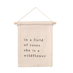 Wildflower Hang Sign - Mini Wall Hanging | "In a field of roses, she is a wildflower" | Wooden Dowel | Canvas Flag | Wall Hanging | Boho