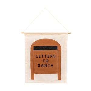 cartas para o papai noel pendurado na parede