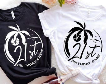 May include: Two black and white t-shirts with a palm tree and the text "21st Birthday Crew" and "21st Birthday Babe".