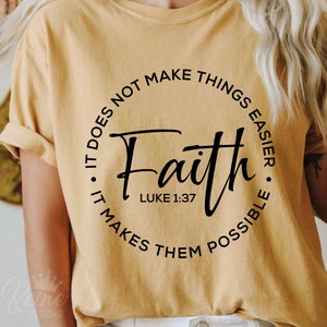 May include: A yellow t-shirt with a black circle graphic that says "Faith" with the scripture Luke 1:37 and the text "It does not make things easier. It makes them possible."