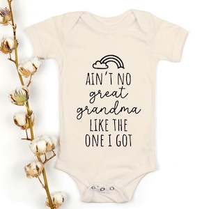 May include: A white baby onesie with a black graphic that reads "Ain't no great grandma like the one I got". A rainbow is above the text.