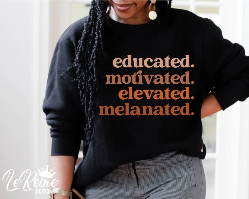 May include: Black sweatshirt with the text "educated. motivated. elevated. melanated." in orange and brown lettering.