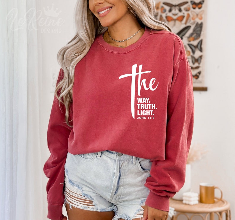May include: Red long-sleeve sweatshirt with white text that reads "the way, truth, light. John 14:6"
