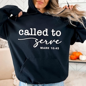May include: Black hooded sweatshirt with the text "called to serve" and "MARK 10:45" in white.