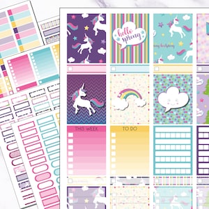May include: A sheet of planner stickers featuring various designs including white unicorns, rainbows, clouds, and colorful patterns. The stickers include text labels such as hello spring, THIS WEEK, and TO DO, along with checkboxes and rectangular boxes.