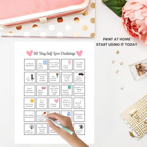 May include: A printable 30-day self-love challenge chart with pink hearts at the top. The chart is divided into 30 squares, each with a different self-care activity. The activities include things like meditating, journaling, taking a bubble bath, and enjoying organic chocolate.