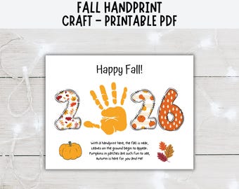 May include: A printable PDF craft sheet featuring the text Happy Fall and a poem. The design includes the number 2026 with a yellow handprint replacing the zero. The numbers feature autumn patterns, and there is a pumpkin and colorful leaves.