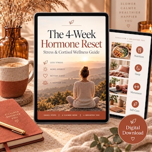 May include: A digital tablet displays a wellness guide titled The 4-Week Hormone Reset, featuring a person sitting in a meditative pose overlooking a mountain landscape. The screen includes text about stress, energy, sleep, and a happier you.