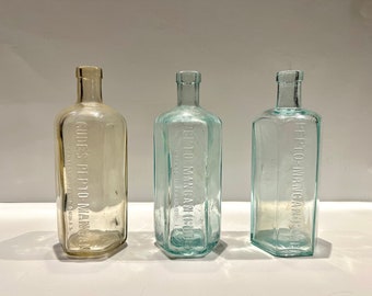 Trio of vintage Medicine bottles - Pepto Mangan Gude