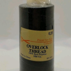 May include: Black overlock thread spool with a yellow label. The label reads "OVERLOCK THREAD 100% Spun Polyester 3000 Yds." and "Priced Sew Right Collection." The spool is wrapped in clear plastic.