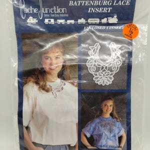 May include: A package featuring an oval Battenburg lace insert. The package includes a photo of a woman wearing a white shirt with the lace insert. The text "Cache Junction" and "Seitec: Sew Easy Industries" are visible. A "Special 1/2 Price" sticker is also present.