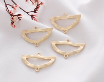 May include: Four gold-toned metal half-circle pendant charms with a hammered texture and three jump rings.