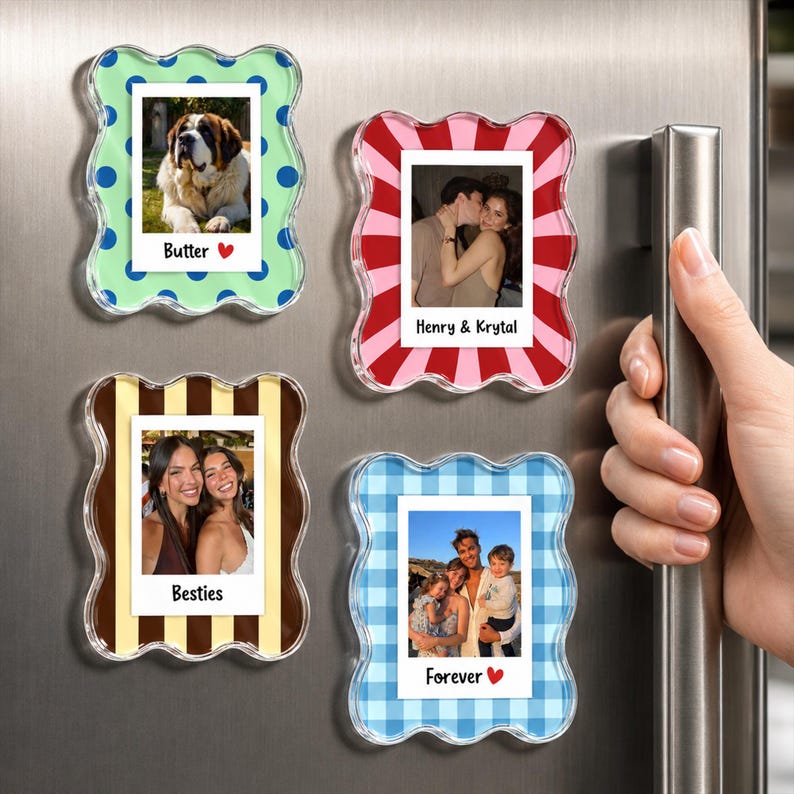 May include: Four rectangular acrylic photo frames with wavy edges, each displaying a different photograph. The frames feature patterns including blue polka dots, pink and red sunburst stripes, brown and tan stripes, and blue gingham check.