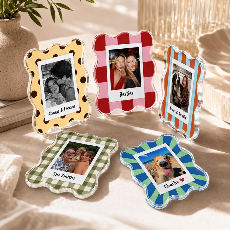 May include: Five wavy-edged acrylic photo frames featuring various patterns including yellow with brown dots, red and pink stripes, orange and blue stripes, green gingham, and blue and green sunbursts, each displaying a custom photo and text.