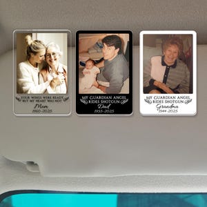 May include: Three memorial car visor clips with photos of loved ones. Each clip has a different photo and text: "Your wings were ready but my heart was not Mom 1960-2025", "My guardian angel rides shotgun Dad 1955-2025", and "My guardian angel rides shotgun Grandma 1944-2025".