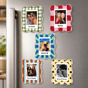 May include: Five scalloped-edge magnetic photo frames with various patterns: green gingham, red stripes, blue and green sunburst, blue and orange stripes, and yellow with brown polka dots. Each frame displays a photo and custom text labels.