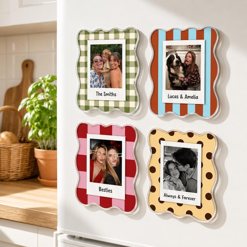May include: Four wavy-edged magnetic photo frames featuring distinct patterns: green gingham, blue and orange stripes, red and pink blocks, and yellow with brown polka dots. Each frame holds a square photograph with a white border and custom text.