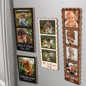 May include: Four vertical wooden photo frames with magnetic backs. Two rectangular frames feature dark wood with white text reading Anna & Kelvin Est. 2019 and FOREVER LOVED 5.20.12-6.6.26. Two scalloped frames feature light and medium wood with text reading The Enderson 2026 and Baby Johnson 2026.