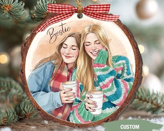 May include: A wooden Christmas ornament with a watercolor illustration of two smiling women holding coffee cups. The word "Bestie" is written above the image. A red and white checkered ribbon and twine are attached for hanging. The bottom right corner has the text "CUSTOM TEXT & PHOTO".