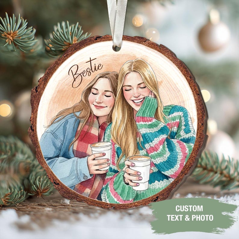 May include: A round wooden ornament with a watercolor illustration of two smiling people holding coffee cups. The word "Bestie" is written above the illustration. The ornament has a white ribbon for hanging and the text "CUSTOM TEXT & PHOTO" is visible.