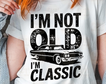May include: A white t-shirt with black text that reads "I'm not old I'm classic" and a black and white illustration of a classic car.