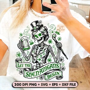 May include: White t-shirt featuring a skeleton in a top hat, holding a beer and cane, with the text "Let the Shenanigans Begin." The design includes shamrocks and a banner. The image also includes the text "300 DPI PNG + SVG + EPS + DXF FILE."