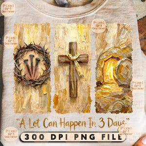 May include: A beige sweatshirt featuring an artistic design with religious symbols. The design includes a crown of thorns with nails, a wooden cross, and a depiction of an empty tomb. The text "A Lot Can Happen In 3 Days" is also present.