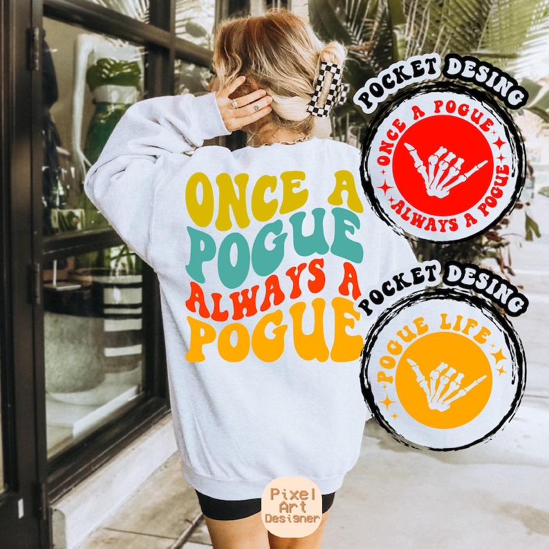 May include: White sweatshirt with the text "Once a Pogue Always a Pogue" in colourful retro font. Two circular patches with a skeleton hand design and the text "Once a Pogue Always a Pogue" and "Pogue Life" are shown.
